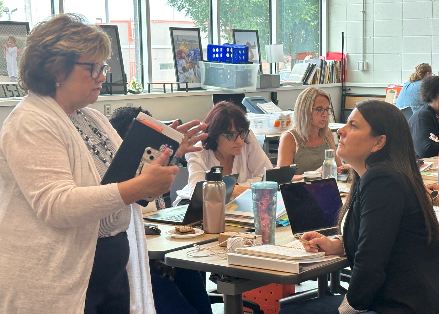 RWL coordinator works with teacher in workshop setting