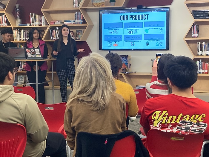 Students presenting to a client.